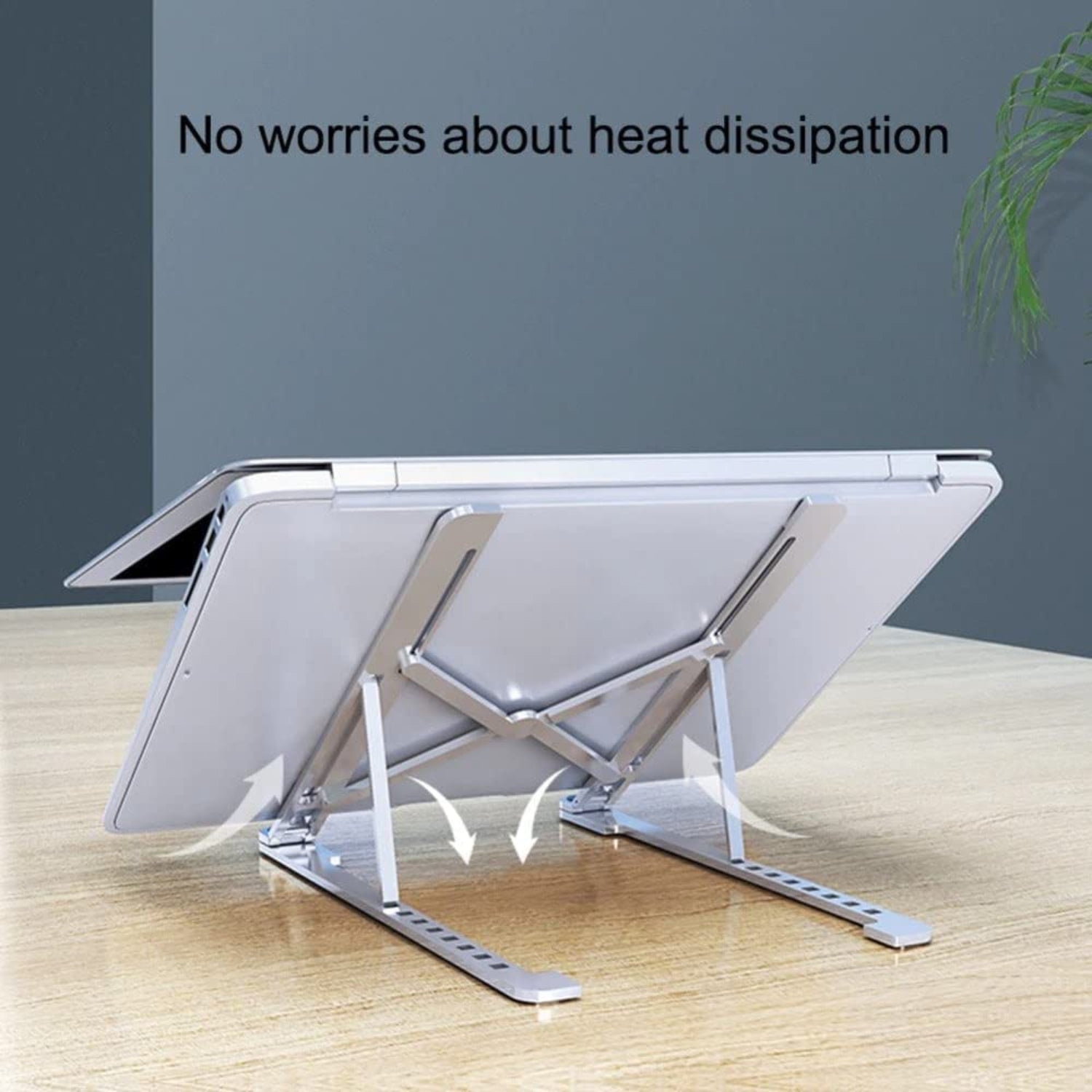 Laptop stand on a wooden surface with text 'No worries about heat dissipation' against a dark gray wall.