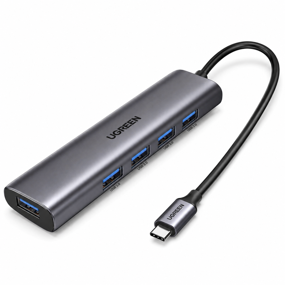 A UGREEN USB-C hub adapter with a metallic dark gray body, featuring four USB 3.0 ports with blue accents, one USB-C port, and a black power cable with a USB-C connector, shown on a white background.