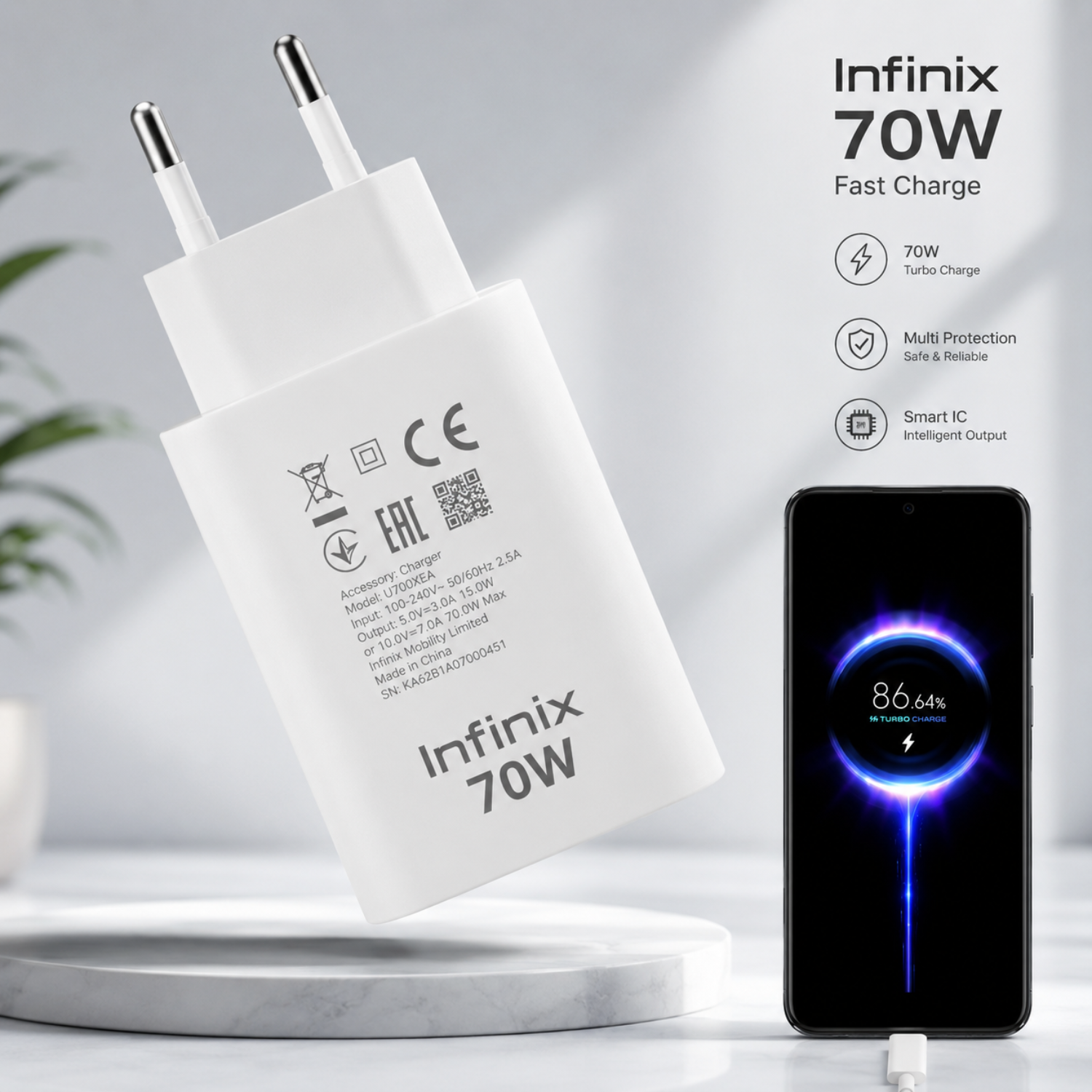 White Infinix 70W fast charger with two-pin plug, shown beside a smartphone displaying a blue charging graphic. Text on the right highlights 70W turbo charge, multi protection, smart IC, and intelligent output.